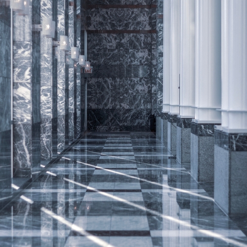 Ultra-modern building facade with reflective glass tiles.