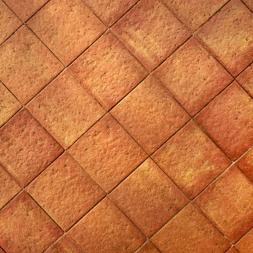 Mediterranean-style villa facade with warm terracotta tiles.